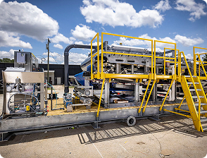 Mobile dewatering services with belt press, screw press and ancillary equipment